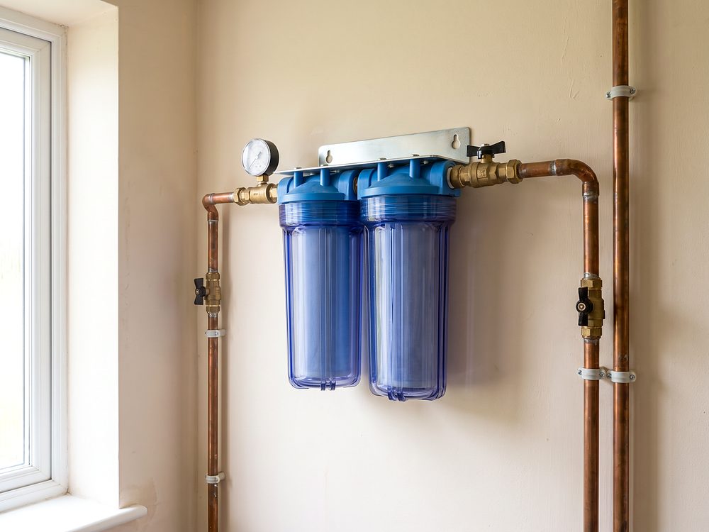 A whole house water filter fitted with copper pipework